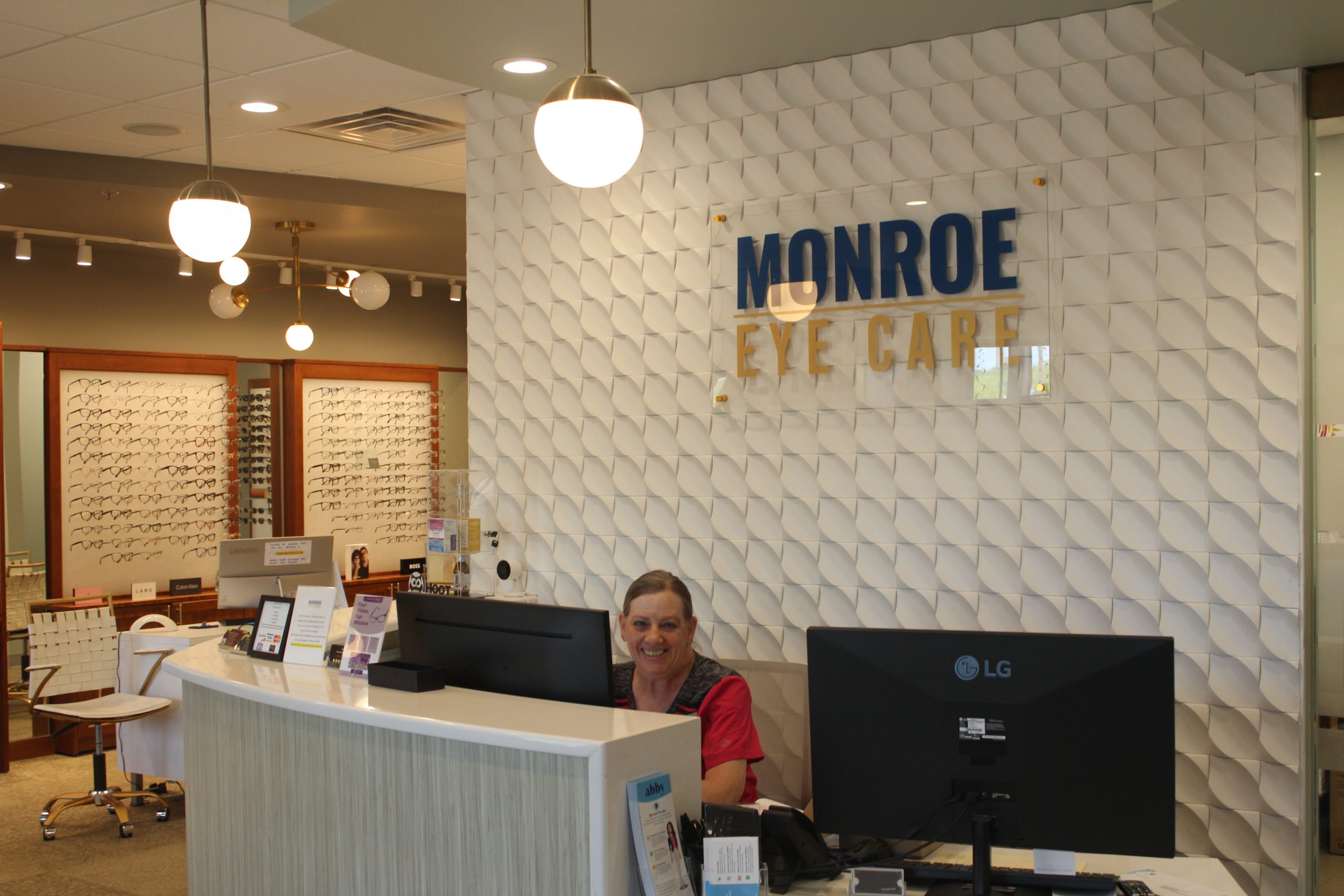 The Monroe Eye Care team welcoming patients at the front desk